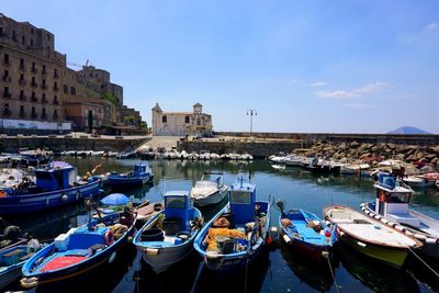 Boats moored at harbor