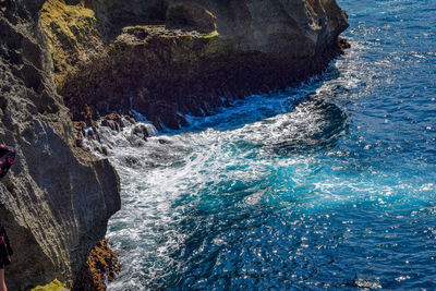 Sea waves splashing on rock