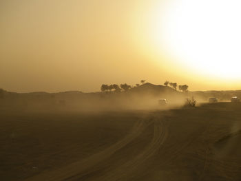 Scenic view of landscape against sky during sunset