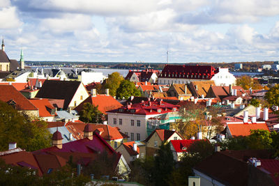 Houses in city against sky