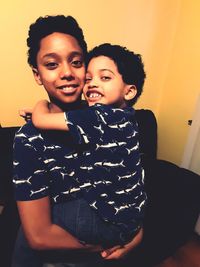 Portrait of smiling woman at home