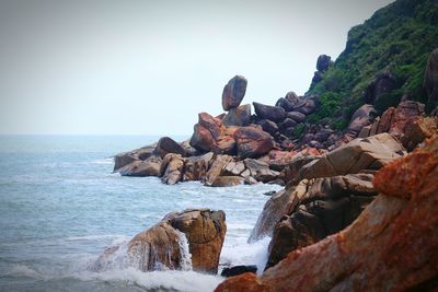 Scenic shot of rock formations in sea