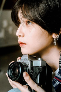 Portrait of woman photographing
