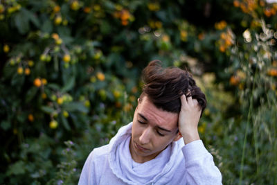 Portrait of man against plants