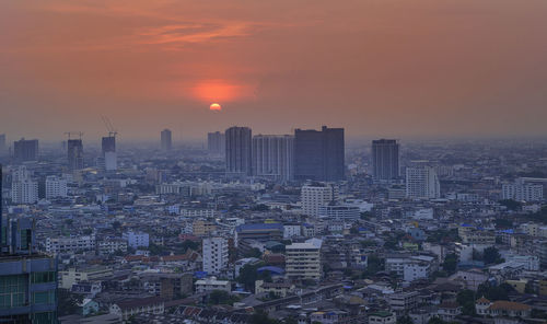 High angle view of buildings against sky during sunset