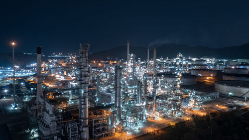  chemical industry storage tank and oil refinery in industrial plant at night over lighting, fuel 