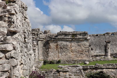 Old ruins of building against cloudy sky