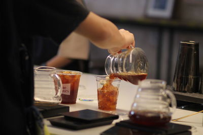 Midsection of woman preparing food on table