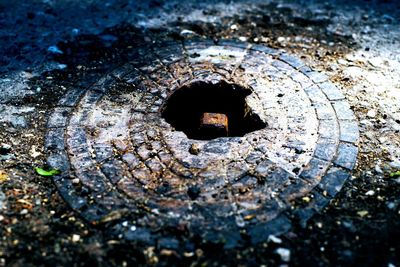 High angle view of rusty metal on street