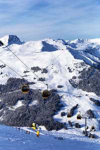 Aerial view of snowcapped mountains against sky