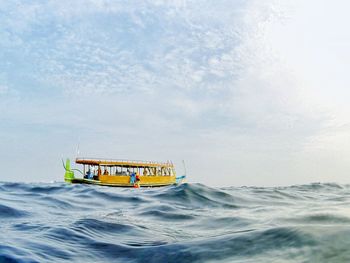 Boat in sea against sky