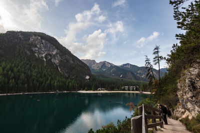 Scenic view of lake and mountains against sky