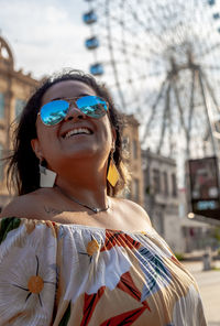 Portrait of young woman wearing sunglasses