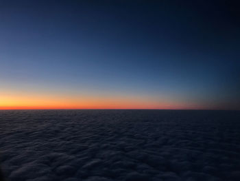 Scenic view of sea against clear sky during sunset