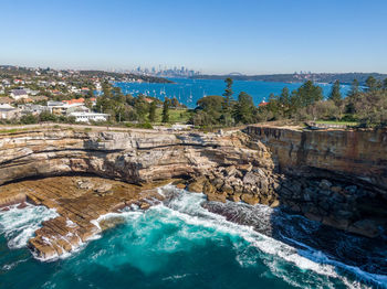Drone view of the gap, an ocean cliff on the south head peninsula in watson's bay in eastern sydney.