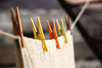 Close-up of clothespins on clothesline