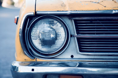 Close-up of vintage car against blue sky