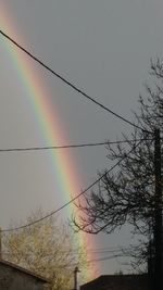 Low angle view of rainbow against sky