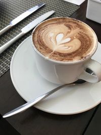 Close-up of cappuccino on table