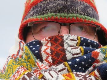 Close-up of person wearing mask in winter