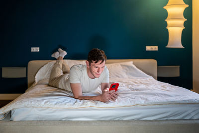 Young woman sleeping on bed at home