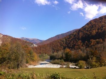 Scenic view of landscape and mountains against sky