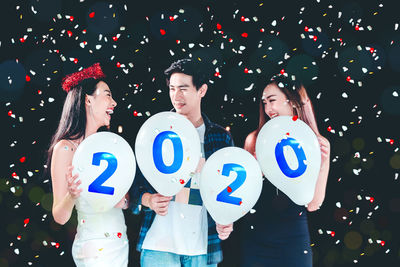 Group of people against gray background
