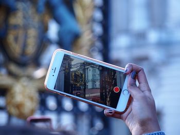 Midsection of woman using mobile phone