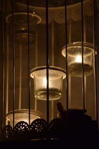 Close-up of illuminated lamp hanging at night