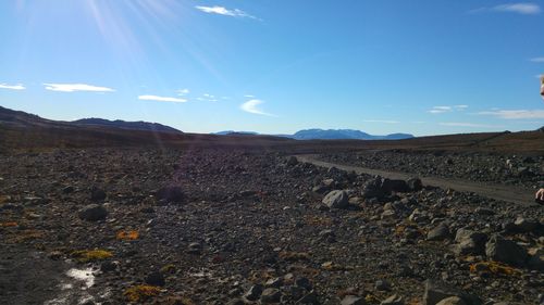 Scenic view of landscape against blue sky