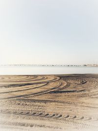 Scenic view of beach against clear sky