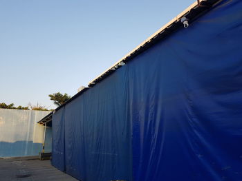 Low angle view of building against clear blue sky