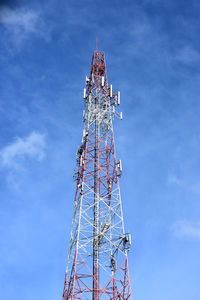 Low angle view of communications tower against sky