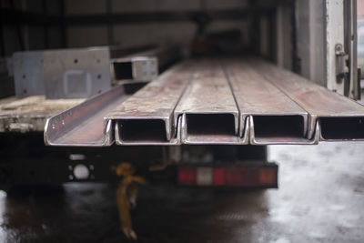 Steel beams in stock. metal products in the workshop. the metal is prepared for loading. 