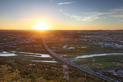 High angle view of cityscape against sky during sunset