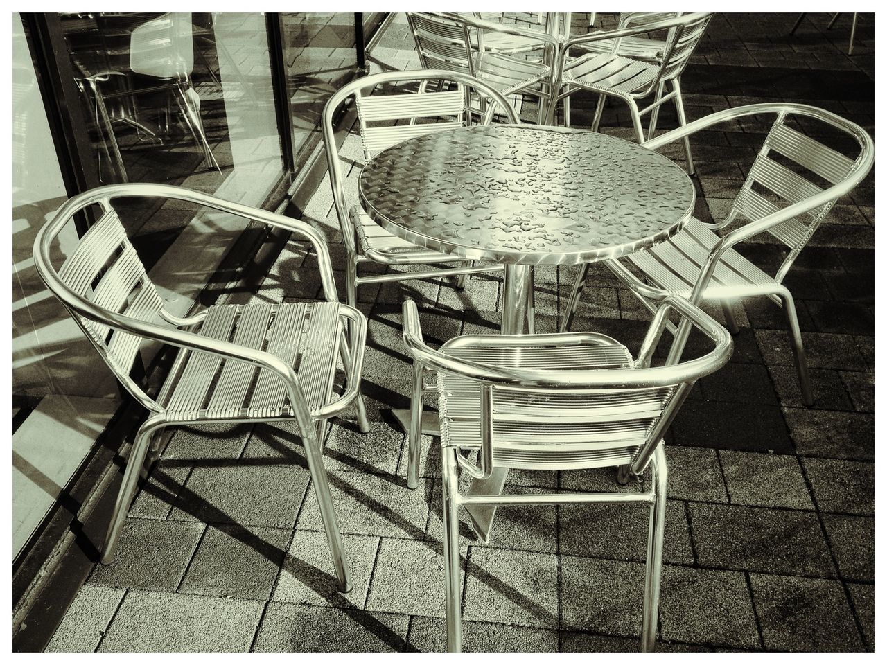 EMPTY CHAIRS AND TABLES IN SHOPPING CART