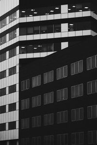 Low angle view of modern building in city at night