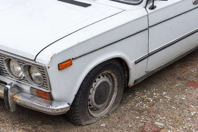 Old car parked on street