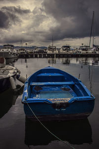 Boats moored at harbor