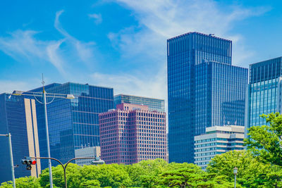 Low angle view of skyscrapers against sky