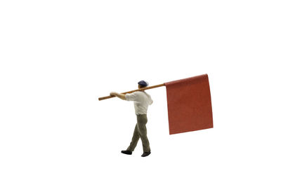 Rear view of man standing against white background