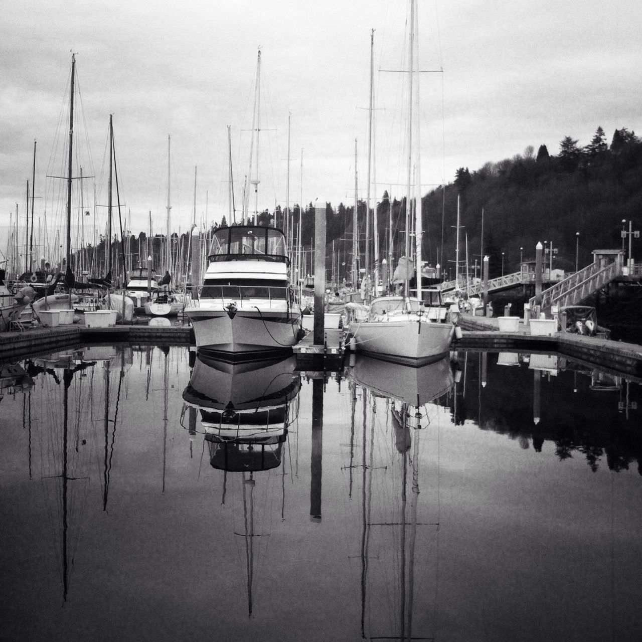 nautical vessel, moored, transportation, water, boat, mode of transport, mast, reflection, harbor, sailboat, sky, waterfront, lake, marina, travel, sea, nature, in a row, outdoors, yacht