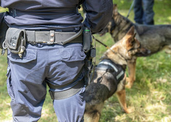 Police officer with k9 canine german shepherd police dog