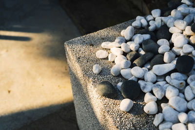 High angle view of pebble stones on land