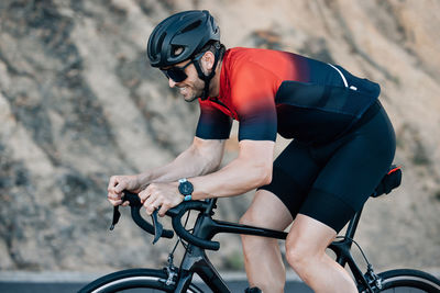 Man riding bicycle on mountain