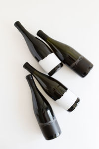 Close-up of bottles against white background
