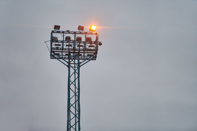 Security watchtower for observing. viewing tower with spotlights on evening sky background