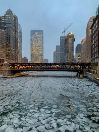 River in city during winter