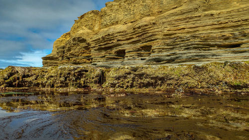 Scenic view of rock formation against sky