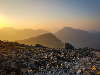 Scenic view of mountains against sky during sunset